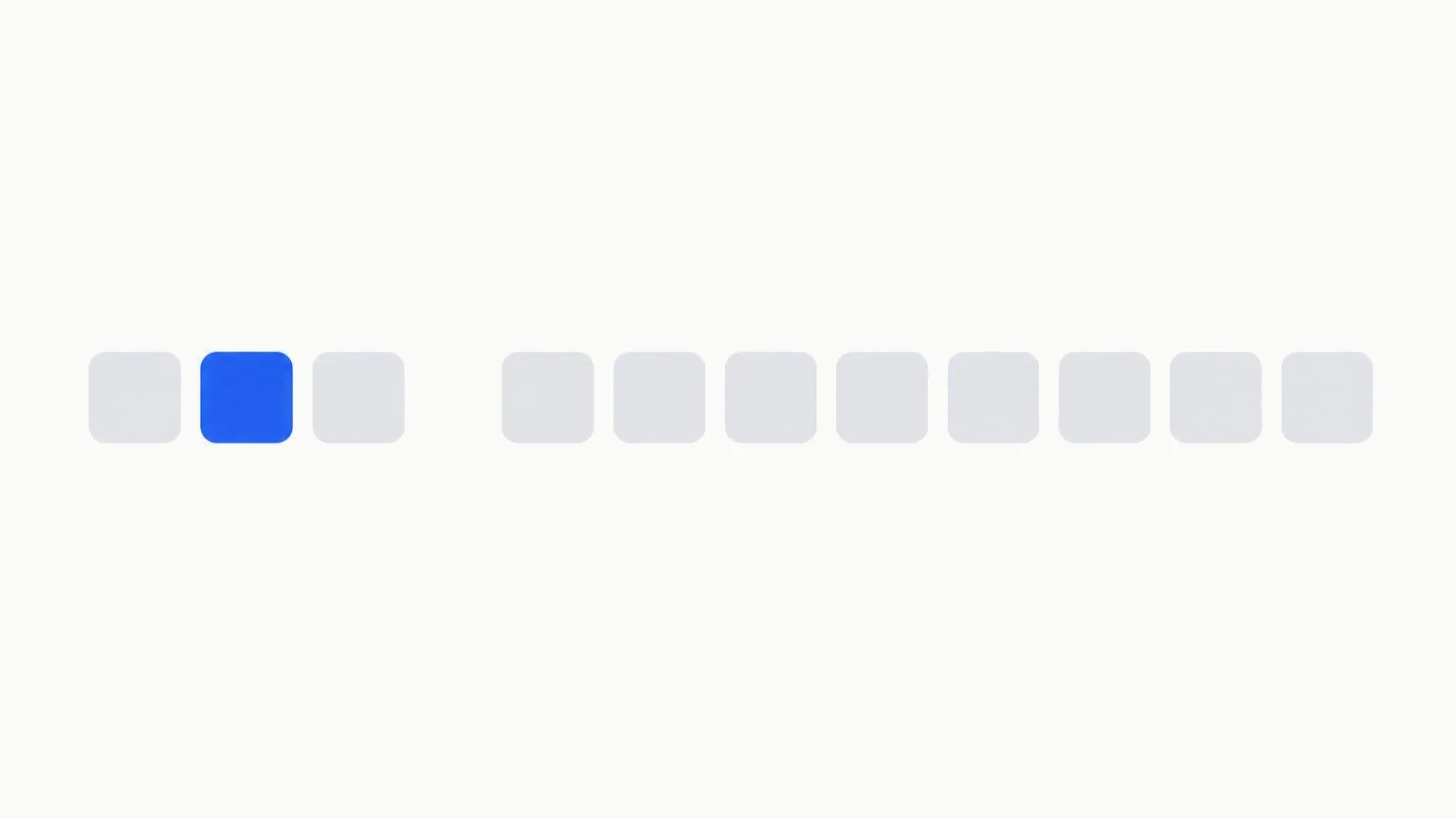 A row of small grey tiles, a few set apart with one highlighted in blue